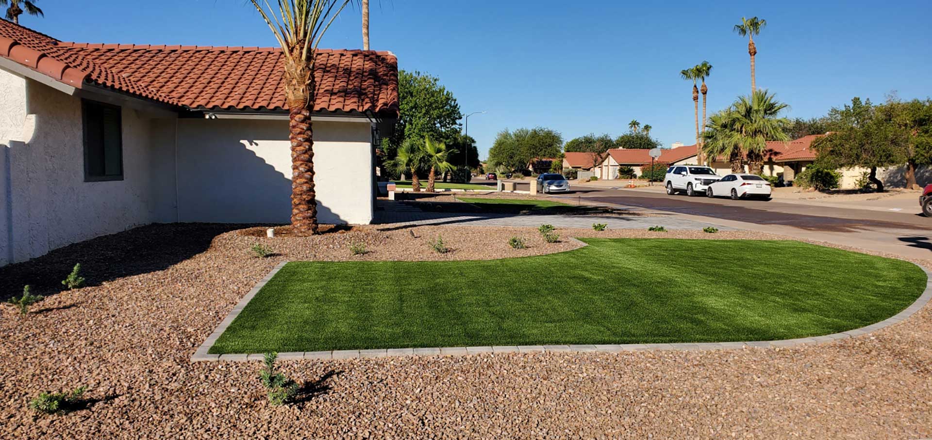 Fresh lawn turf and rock mulch installed at a home in Scottsdale, AZ.