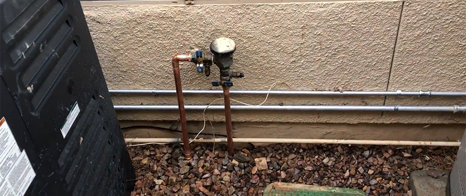 An irrigation system beside a wall in Scottsdale, AZ.