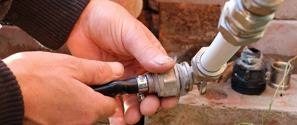 A professional repairing an irrigation system in Scottsdale, AZ.