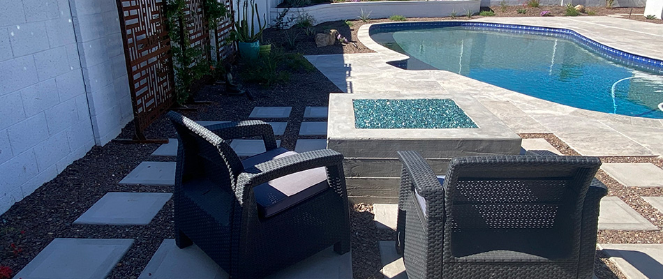 Square gas fire pit installed by pool in Scottsdale, AZ.